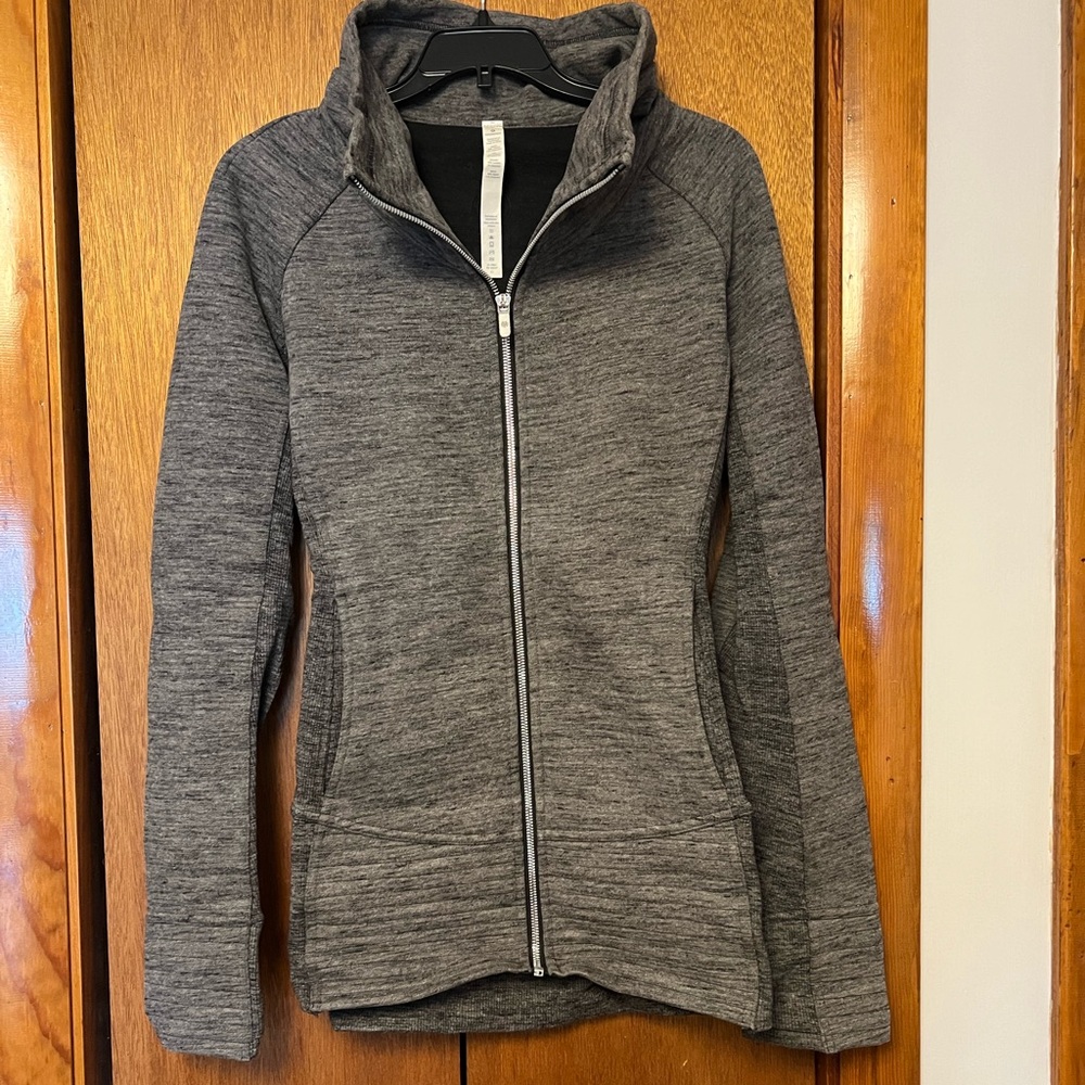 Gray zip up jacket with pockets and thumb holes